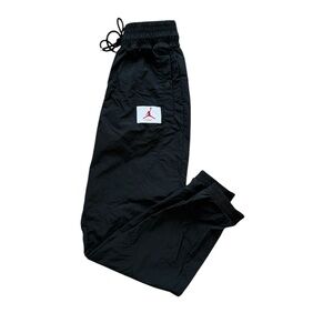Black Nike Joggers with Red Jordan Logo